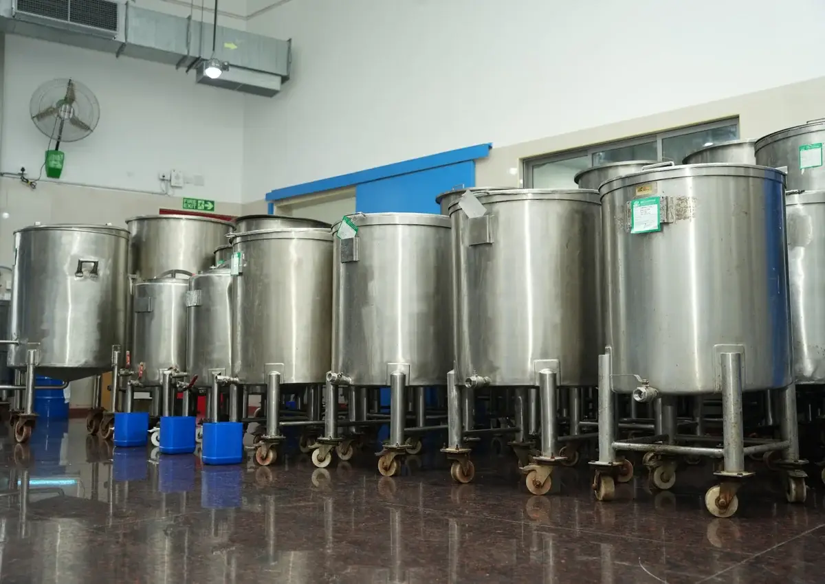 Stainless-steel feed and emulsion tanks at the plant
