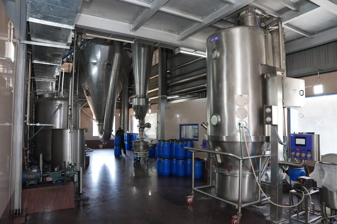 Spray-dryer hall with drying chamber and cyclone