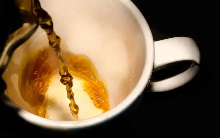 Tea being poured into a cup